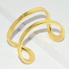 Designed to wrap your wrist in glistening shine, this sinuous wrist cuff is both sculptural and minimalist. * Cuff slightly adjustable to fit most *PRODUCT DETAILSMaterials: Pewter casting with either 24 kt gold plating / Sterling silver plating / Rose gold plating.Measurements: 2" width. As seen on Fifth Harmony Singer Camila Cabello: Wows the Teen Choice Awards crowd with her all black outfit and Elise split cuff she chooses to wear on her upper arm. This cuff is so volatile it can be worn man Adjustable Contemporary Cuff Bracelet, Modern Gold Double Band Cuff Bracelet, Adjustable Gold Bangle With A Modern Twist, Adjustable Metal Bangle With A Modern Twist, Adjustable Bangle With A Modern Twist, Modern Adjustable Cuff Bracelet For Party, Modern Adjustable Cuff Bracelet For Parties, Adjustable Modern Cuff Bracelet For Party, Modern Adjustable Cuff Bracelet For Formal Occasions