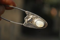 Handmade jewelry bird shawl safety pin brooch with Mother of Pearl. Unique handmade jewelry gift for woman. Large safety pin brooch for shawl, scarf, sweater or kilt. Sterling silver handmade jewelry.  Silversmith brooch with Mother of pearl and bird for woman.  Coat brooch / scarf pin / kilt pin / sweater pin brooch.  Ready to ship  Our other works:  https://www.etsy.com/shop/FaunaSilverGems Coat Brooch, Brooch Scarf, Woman Coat, Scarf Sweater, Large Safety Pin, Unique Sweater, Sweater Pin, Safety Pin Brooch, Kilt Pin