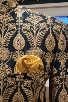 Elevate your style with our exquisite Deep Green Prince Coat with Golden Embroidery Work. This luxurious piece is crafted from raw silk fabric and adorned with intricate golden embroidery, making it the perfect choice for any special occasion. For online prices plz visit: https://uomoattire.com/ or ☎️ Call/WhatsApp on +92300-7668666 / 0300-7618666 #deepgreenprincecoat #goldenembroiderywork #groomwear #weddingattire #formalwear #traditionalshowcase #luxurious #elegant #sophisticated #madetorule Festive Raw Silk Bandhgala With Floral Embroidery, Festive Bandhgala With Floral Embroidery In Raw Silk, Designer Embroidered Bandhgala For Reception, Festive Bandhgala With Floral Embroidery For Wedding, Festive Floral Embroidered Bandhgala For Wedding, Brocade Sets With Floral Embroidery For Reception, Designer Sets With Floral Embroidery And Traditional Drape, Designer Sets With Floral Embroidery For Festive Season, Designer Festive Sets With Floral Embroidery