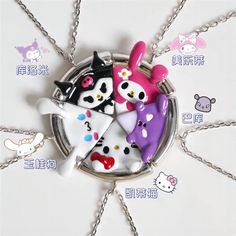 the keychain is decorated with four cartoon cats and one has a heart on it