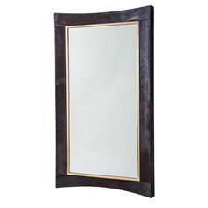 a mirror that is sitting on top of a wall with a gold trim around it