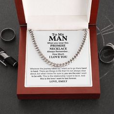 an open box with two rings and a necklace in it that says to my man i love you