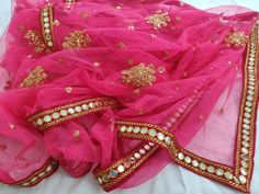 Neon Pink Lehenga dupatta for women wedding wear. Size: Dupatta is 100 inches (2.5 meter) long and 40 inches (1 meter) wide. Length of this dupatta can be customized as per your requirement. Fabric and work: Heavy sequins work net fabric with a mirror work lace border.Mirrors are not real they are foil mirrors. Delivery time: This dupatta will take 3-4 days to produce after we have received your order. While ordered with standard shipping it takes around 2-3 weeks in transit after we dispatch it Chunni Ceremony, Pink Dupatta, Dresses Handmade, Bridal Dupatta, Dark Red Dresses, Lehenga Suit, Rose Gold Dress, Golden Lace, Pink Lehenga