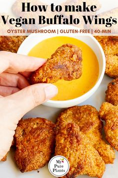 a person dipping something into a bowl of soup with chicken nuggies on the side