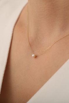 14K Solid Gold Dainty Pearl Necklace / Minimalist Pearl Necklace /Handmade Pearl Jewelry / Gift for Her / Mothers Day Gift / anniversary gift / birthday gift / chocker necklace   * Gold KT: 14K Solid Gold * Gold Color: 14K Gold * The length of the chain in the photo is 17 inches. * The pearl used in the necklace is a real cultured pearl. Follow on Instagram - @bayargold.tr My Web Site - https://www.bayargold.com/ * Bayar Gold is a fine jewelry company. Please do not hesitate to ask us questions. We are always here to help you. * All items are packed in the high-quality jewelry box. The gift message is available. Please let us know what to write by leaving us a note at checkout.  * Gift wrapping available.  Express shipping * United States: 4-6 business days * Canada: 4-6 business days * Eu Minimalist White Pendant Birthstone Necklace, Minimalist Everyday Pearl Necklace With Round Pendant, Handmade Delicate Charm Necklace For Everyday, Everyday Minimalist Pendant Birthstone Necklace, Everyday Minimalist Handmade Necklace, Delicate Necklace With Simple Design For Gifts, Delicate Everyday Necklaces With Simple Design, White Necklace With Simple Design As Gift, White Necklace With Simple Design For Gift