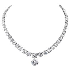 Haute-joaillerie diamond necklace riviera style with a diamond pendant. The necklace is comprising of 67 graduated round-cut diamonds, mounted in platinum. 16 diamonds are GIA certified weighing from 0.73 carats to 3 carats. The colors are from D to F, clarity from IF to SI1. The center diamond in the necklace is 3 carats, F VVS2. A copy of the GIA report is attached to the pictures. Pendant is a 6.54 carat round diamond F VVS1. Certified by GIA. Total weight of diamonds in the necklace is 44.72 carats. Total weight of diamonds including pendant is 51.26 carats. Metal is platinum; gross weight 60 grams. Length of the necklace without the pendant is 15 1/4 inches. The copies of all the GIA reports will be provided upon request. 1stdibs Diamond Necklace, Luxury Gia Certified Collectible Jewelry, Luxury Refined Diamond Necklace With Prong Setting, Luxury Dazzling Diamond Necklace With Prong Setting, Luxury Platinum Diamond Pendant Necklace, Luxury Fine Jewelry Three Stone Necklace, Luxury White Gold Necklace With Gemstone, Luxury Fine Jewelry Necklace With Three Stones, Luxury Diamond Necklace With Pave Setting