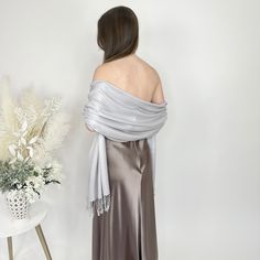 A silver pashmina scarf is versatile and will go with any bridesmaid dress and match any wedding theme. Its simply a classic and a must for winter and chilly outdoor weddings! Our wedding pashminas are extremely soft and will keep your guests warm at your wedding reception and they are great pashmina wedding favors for your guests as they are high quality. A prefect bridesmaid proposal gift is a silver bridesmaid pashmina! A pashmina scarf is also a great favor gift for guests at a bridal shower Elegant Winter Pashmina Shawl, Elegant Winter Formal Pashmina Shawl, Elegant Winter Pashmina Shawl For Formal Occasions, Formal Elegant Pashmina Shawl, Elegant Pashmina Shawl For Evening, Elegant Winter Wedding Pashmina Shawl, Elegant Pashmina Shawl For Wedding, Winter Wedding Pashmina Shawl, Elegant Wedding Pashmina Shawl