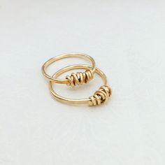 "A beautiful wire wrapped 14k gold filled ring. This delicate handmade gold filled ring with a special wire wrap texture at the top has a chic and sophisticated look. This ring looks great as a minimalist single piece, but will look even better when layered with other rings. This ring is made from high quality 14K \"Gold Filled\" - unlike \"gold plating\" the gold in gold filled jewelry is mechanically bonded to the base metal, and it will not wear off or turn black. This ring literally goes wit Delicate 14k Gold Filled Midi Rings For Gift, Elegant 14k Gold Wire Wrapped Rings, Gold 14k Gold Filled Rings For Gift, Minimalist Hand Wrapped Ring For Gift, Gold 14k Gold-filled Rings For Gift, 14k Gold Filled Open Midi Rings As Gift, Gold Rings 14k Gold Filled Gift, Minimalist Hand-wrapped Jewelry For Anniversary, Minimalist Hand Wrapped Jewelry For Anniversary