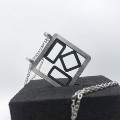 This modern statement pendant in recycled sterling silver is individually designed and made from scratch using traditional silversmithing techniques in my studio in London. Completely made by hand and custom to your personality, it requires up to 2 business days to be dispatched.  Why you need this pendant:  ‣‣ Geometric design with patina for trendy looks ‣‣ Available with matching earrings and ring ‣‣ Perfect for day-to-night outfits ‣‣ All handmade unique present for yourself and your loved ones  ‣‣ Gift boxed with a personalised message card  ‣‣ Free, fast, and secure shipping  ‣‣ 13% OFF with this coupon (excluding Sale items):  https://www.etsy.com/uk/shop/AndyKashtanJewellery?coupon=1STPURCHASE MORE DETAILS: This unique statement pendant is handcrafted from recycled sterling silver Uncommon Gifts, Geometric Pendant Necklace, Unique Silver Jewelry, Personalised Gift Boxes, Made From Scratch, Paper Jewelry, Handmade Jewelry Gift, Uk Gifts, Geometric Pendant