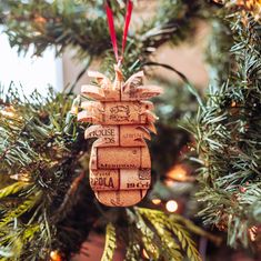 a wine cork ornament hanging from a christmas tree