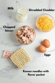 ingredients to make an egg and cheese sandwich laid out on a white marble counter top