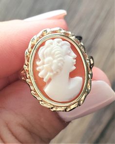 Vintage Cameo ring. Details: Size: US 6 ( Can be sized ) Weight: 3.2 grams Primary stone: Cameo Stone shape: Oval Band Width: Appx. 2mm Metal: 14k Yellow Gold Condition: Previously owned/great condition Inside of band is stamped and tested for '14k' gold. All pieces are polished and refinished in our shop. SIZING: Currently this ring is a size 6 but could be sized up or down for an additional small fee if desired by adding custom ring sizing to your cart upon checkout. Most sizing can be done wi Luxury Vintage Cameo Ring, Classic Oval Cameo Rings, Yellow Gold Polished Opal Ring, Exquisite Carved Jewelry For Anniversary, Classic Polished Opal Ring, Elegant Carved White Gold Rings, Elegant Carved Jewelry For Promise Ring, Cameo 14k Gold Rings For Anniversary, Cameo 14k Gold Rings For Collectors