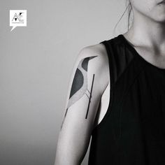 a woman with a tattoo on her arm