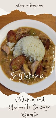 a white plate topped with meat and rice covered in gravy on top of a wooden table