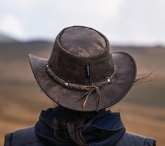 "Genuine leather hats, Personalized hats from Wombat Outdoor Leather style Australian Bush Hats For any campers or hikers planning their trips during the spring and summer check out this rugged camouflage brown leather hat which we have called The Wilds. It is the perfect hat to take away with you on holiday, as the soft foldable/crushable leather allows it to be packed away without taking up too much or affecting the shape when you take it back out. The hat stays looking strong and durable with the worn effect giving it a classically aged appeal. When you head out into the country to explore the wide open spaces you need accessories that are functional and this soft leather hat ticks those boxes while also being incredibly stylish. Not only that, but the unique leather grain found on each Rugged Hunting Hat With Curved Brim, Rugged Leather Hat With Flat Brim, Rugged Flat Brim Hunting Hat, Rugged Leather Hat Bands For Outdoor, Country Style Wide Brim Top Hat For Outdoor, Rugged Brimmed Hat For Rodeo, Rugged Leather Hats For Outdoors, Rugged Leather Hat For Outdoor, Rugged Short Brim Hat For Rodeo