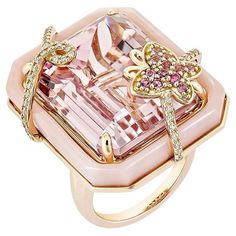 An ancient Kunzite ring with a butterfly studded with pink opal and pink tourmaline that add to the beauty of the ring and with studded diamonds on both sides of the Kunzite that add to the beauty of the ring is shown. This ring is composed of rose gold and is quite attractive. Kunzite Fancy Ring in 18Karat Rose Gold with Pink Tourmaline, Pink Opal and White Diamond. Kunzite: 42.79 carat, 22X17mm size, octagon shape. Pink Tourmaline: 0.09 carat, 1.40mm size, round shape. Pink Tourmaline: 0.09 ca Pink Diamond Gemstones With Accents, Luxury Pink Gemstone With Center Stone, Pink Tourmaline Rings With Gemstone Accents, Luxury Rose Gold Opal Gemstone Ring, Pink Opal Ring With Accent Stones As Gift, Luxury Pink Gold Morganite Jewelry, Luxury Pink Sapphire Ring As A Gift, Luxury Pink Gemstones For Wedding, Pink Opal Gemstone Ring For Anniversary