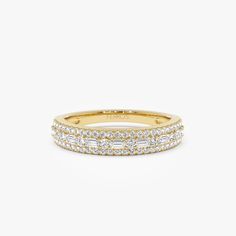 14K Gold Baguette Wedding Band: Featuring a Unique Combination of Prong-Set Baguettes and Micro-Pave Round Elements, This Stackable Ring Radiates Elegance. It is a perfect Half-Eternity Design for Layering or Stand-Alone Grace. ▶Features * Made to Order * Gold Kt: 14K (also available in 18K) * Available Gold Color: Rose Gold, Yellow Gold, White Gold * Round Diamond: 50 pcs 1.0 MM  * Round Diamond: 8 pcs 1.3 MM  * Baguette Diamond: 7 pcs 2.5 x1.3 MM  * Total CTW: 0.40ctw  *  Diamond Color-Clarity Yellow Gold Baguette Cut Halo Ring, Diamond White Eternity Band With Baguette Diamonds For Anniversary, Gold Half Eternity Baguette Ring, Gold Baguette Ring With Half Eternity Detail, Gold Baguette Ring With Half Eternity, Gold Baguette Ring With Half Eternity Design, Gold Baguette Cut Diamond Ring With Halo Design, Gold Baguette Half Eternity Rings, Baguette Diamond Ring With Vvs Clarity