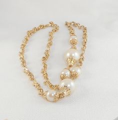 This beautiful gold chain and faux pearl necklace has a unique gold tone chain of curved Brutalist links with two large and 4 smaller faux pearls with gold tone findings measures 30 inches from end to end with a lobster clasp in excellent condition; I see no flaws If you love vintage necklaces, be sure to check out others I have listed! www.etsy.com/shop/SultanaVintageJewels?ref=hdr_shop_menu&section_id=18744319 www.etsy.com/shop/SultanaVintageJewels?ref=hdr_shop_menu&section_id=15212808 Drop Necklace Gold, Big Pearl Necklace, Gold Drop Necklace, Pearl Necklace Gold, Necklace Gold Chain, Goth Necklace, Pearl Drop Necklace, Big Pearl, Pearls Necklace