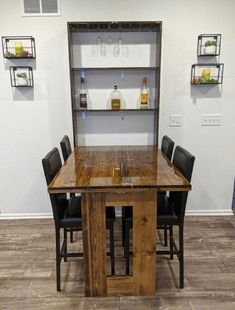 a wooden table with chairs around it