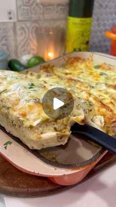 a casserole dish with cheese and vegetables on it