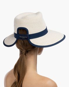 The Sun Crest visor is a stylish hybrid of the classic high-crowned fedora hat and a practical visor with a generous 4-inch brim. This fashionable Squishee® straw hat is trimmed with grosgrain ribbon for a chic, polished finish. You'll turn heads wherever you go this summer. Our revolutionary Squishee material is a synthetic straw fabric constructed from partially recycled plastics. This environmentally friendly material resembles genuine raffia straw, but it offers several practical advantages Straw Fabric, Straw Visor, Art Costume, Visor Hat, Women's Headwear, Costume Institute, Visor Hats, Summer Look, Fedora Hat