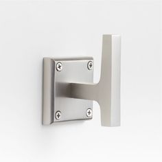 an image of a door handle on a white wall