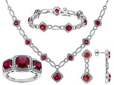 18.39ctw Square Cushion Lab Ruby And 0.02ctw Round White Diamond Rhodium Over Brass Necklace, Bracelet, Ring And Earring Jewelry Set. Necklace Measures Approximately 18"L x 0.99"W With Lobster Clasp Closure. Bracelet Measures Approximately 7.25" x 0.42"W With Hidden Box Clasp Closure And Safety Lock. Ring Measures Approximately 0.89"L x 0.44"W. Not Sizeable. Dangle Earrings Measure Approximately 1.25"L x 0.43"W With Pushbackings. Valentine's Day Cubic Zirconia Gemstone Jewelry, Luxury Ruby Jewelry With Pave Setting, Classic Cubic Zirconia Jewelry For Valentine's Day, Diamond White Jewelry For Valentine's Day, Round Cut Jewelry For Valentine's Day Formal, Round Cut Jewelry For Valentine's Day Formal Occasions, Diamond White Jewelry For Valentine's Day Formal Occasion, Fine Jewelry With Pave Setting, Anniversary Diamond Gemstone Jewelry Sets