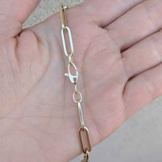 "Our best-selling 14k/18k gold rectangular flat paperclip chain in our biggest size: Extra Large. Choose from 14k/18k yellow, rose and white gold, as well as five different standard lengths (or contact us for a custom length). Layer two or three of our chains for the #neckmess look that is so hot right now! If you are interested in 18k gold, please contact us for a quote. Our rectangular flat paperclip chain comes in: Bracelet: https://etsy.me/2X6jSqM Extra Small: https://etsy.me/318xBN0 Small: 14k Gold Rectangular Paperclip Chain Bracelet, 14k Gold Paperclip Bracelet With Lobster Clasp, Formal Paperclip Bracelet With Lobster Clasp, Gold Rectangular Paperclip Bracelet With Lobster Clasp, Modern 14k Gold Paperclip Bracelet, Formal 14k Gold Paperclip Jewelry, 14k Gold Link Paperclip Bracelet, 14k Gold Paperclip Chain Jewelry, Modern 14k Gold Paperclip Bracelet With Lobster Clasp