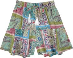 A comfortable fully lined cotton voile skorts, a cross style between a mini skirt and shorts, a playful show of abstract floral print in various colors.  It has bright white fabric tassels attached to the drawstring ends which gives it an urban bohemian look. #tlb #JuniorPetite #vacationclothing #beachwrap #Printed #bohemianfashion #BohoShorts #VacationShorts #FloralShorts #FunSummerSkort Bohemian Printed Summer Shorts, Multicolor Boho Print Summer Bottoms, Bohemian Multicolor Spring Shorts, Green Bohemian Shorts For Summer, Bohemian Green Shorts For Beach, Green Printed Summer Shorts, Multicolor Floral Print Cotton Shorts, Green Printed Shorts For Summer, Bohemian Summer Bottoms With Colorful Pattern