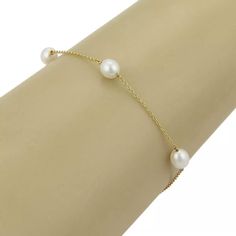 This is an elegant freshwater cultured pearls bracelet from the house of Tiffany & Co. by designer Elsa Peretti from her Pearls by The Yard collection. It has 5 luminious pearls scattered along a delicate 18k yellow gold chain. It is fully signed with Tiffany & Co, Peretti, and the gold content.      Material: 18k yellow gold           Hallmark: T&Co. 750 /   Peretti   Measurements: 7.5" long.    Pearls: 6.5mm long x 6mm wide  Weight: 3.2 grams Cultured Pearl Bracelet, Pearls Bracelet, Elsa Peretti, Freshwater Pearl Bracelet, Fine Jewelry Bracelets, Yellow Gold Bracelet, Yellow Gold Chain, Freshwater Cultured Pearls, Gold Pearl