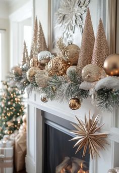 a fireplace mantel decorated with gold and silver ornaments