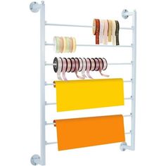 a white rack with several rolls of tape on it