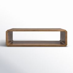 a wooden shelf sitting on top of a white wall