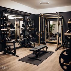 a home gym with black walls and wooden floors