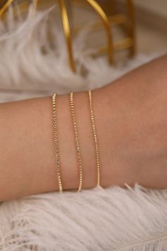 14k Gold Ball Chain Bracelet, Solid Gold Bracelet, Yellow Gold Dainty Chain, Bracelet Stack, Dainty Gold Bracelet, A Great Gift, Selena Wear it by itself or stack them up with your other bracelets ⁕⁕ Handmade ⁕⁕ Solid Gold ⁕⁕ Chain Width : 1mm - 1.3mm - 1.5mm ⁕⁕ High-End Polish Orders with free shipping go out with USPS First Class Mail tracking. We require a signature for orders more than $500. If you need a signature required service, you can select that service in the shipping options on your Gold Beaded Chain Bangle Jewelry, Dainty Round Chain Bracelet For Party, Dainty Gold Bracelet With Box Chain, Dainty Chain Bracelets For Wedding, Elegant Chain Bracelets For Jewelry Making, Elegant Jewelry With Box Chain And Round Beads, Rose Gold Satellite Chain Bracelet As Gift, Dainty Chain Bracelet With Round Beads For Gift, Dainty Box Chain Bracelets For Gifts