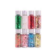 six small bottles filled with different colored glitters