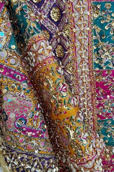 This Multicolor Heavy Embroidered Handwork Pakistani Silk Dupatta with Lining is a stunning piece with intricate handwork of sequins and pearls, a gold lined back and vibrant multi-color block print. Its 2.5 meter size makes it perfect to pair with a Lehenga or Salwar Suit. Stunning and unique, this item is ready to ship from California. Material: Silk Color: Multicolor Pattern: Floral, Block Screen Print Work: Handcrafted sequins, beads, embroidery & pearl work Size: 2.5 meter Condition: New Oc Pakistani Bridal Dupatta, Phulkari Pants, Lucknowi Kurta, Patiala Salwar Suits, Bridal Dupatta, Phulkari Dupatta, Pearl Work, Beads Embroidery, Kurta Dress