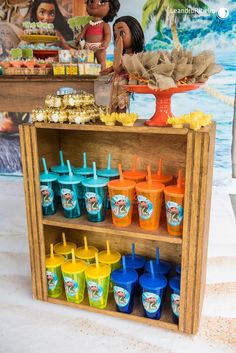 an assortment of ice cream and desserts displayed on a wooden shelf in a children's playroom