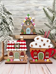 three gingerbread houses with christmas decorations on them