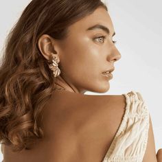 These elegant half flower earrings are a must-have for any jewelry collection. Made from high-quality materials, they add a touch of sophistication to any outfit. With their unique design, these earrings are perfect for both casual and formal occasions. Enhance your style and make a statement with these stunning earrings. Elegant Clip-on Earrings For Evening, Gold Feminine Earrings For Evening, Feminine Gold Earrings For Evening, Feminine Gold Hoop Earrings For Party, Gold Feminine Earrings For Party, Elegant Single Flower Earring For Summer, Feminine Gold Earrings For Party, Evening Single Earring, Feminine Flower Earrings For Gifts