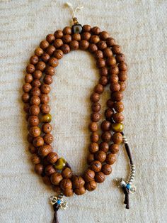 Wonderful used and very good quality Bodhi seeds prayer beads is from Namo Buddha, Nepal. This prayer beads has lots of blessings from many temples and lamas. Counted lots of mantras on this mala. Very nice and smooth. 27 inches long Bodhi mala is perfect for all mantras. With counter, agate Dzi guru beads and extra decoration beads makes Mala more beautiful. Traditional Mala With Gemstone Beads For Healing, Bohemian Hand-strung Healing Rosary, Bohemian Hand-strung Rosary For Healing, Handmade Spiritual Mala For Puja, Spiritual Gemstone Beads Mala For Puja, Spiritual Gemstone Mala For Puja, Holistic Healing Mala With Wooden Beads, Spiritual Rosary For Meditation With Round Beads, Spiritual Rosary With Round Beads For Meditation