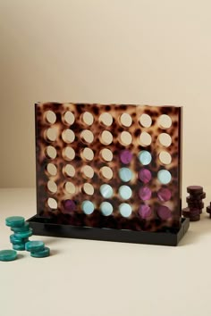 a wooden board game set with several pieces