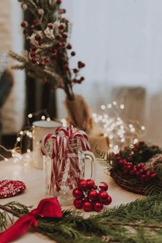 candy canes and christmas decorations on a table