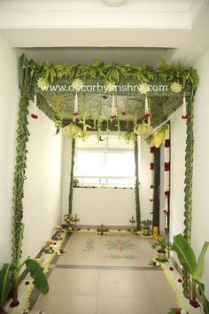 an archway decorated with flowers and greenery