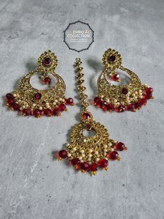 We are thrilled to introduce our exquisite collection of Indian earrings in Maroon color. These stunning earrings are crafted to enhance your style, whether you're attending a party or a wedding ceremony. They are guaranteed to make you stand out in the crowd.Elevate your style with these stunning Earrings. Make a bold fashion statement and turn heads wherever you go. Shop our stunning collection today!We have a wide range of colors available, so be sure to check our other listings to find the perfect match for your style. In addition to this earring, we have a wide variety of Indian Pakistani jewelry. Explore our shop to discover the perfect piece for your collection. If you're having trouble viewing our photos, try increasing your screen brightness for a clearer image.We aim to dispatch Elegant Metal Jewelry Sets For Party, Gold Plated Jewelry Sets For Party, Elegant Chandbali Pearl Earrings For Party, Elegant Plug Earrings For Festive Celebration, Elegant Festive Celebration Plug Earrings, Party Plated Jewelry, Gold-plated Chandbali Bridal Earrings, Gold Plated Chandbali Bridal Earrings, Traditional Red Gold-plated Bridal Earrings