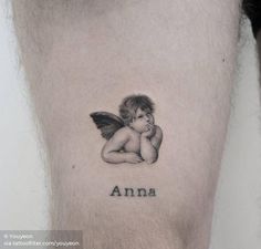 a small tattoo with an angel sitting on top of it's arm and the word ann