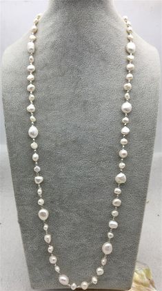 "pearl jewelry: long pearl necklace pearl body: AA pearl grade:AA pearl luster:high pearl shape: nugget pearl length: 30'' pearl color: white AA same type necklace link: https://www.etsy.com/hk-en/listing/472336670/59-inches-aa-nugget-pearl-necklace8-9x9?ref=listings_manager_grid Back to Other Jewelry Section 01: \"Tahitian,Akoya,Sea Pearl\" Section: https://www.etsy.com/shop/WenPearls?section_id=15806339 02: \"Potato/Near Round Pearl\" Section: https://www.etsy.com/shop/WenPearls?section_id=163 White Baroque Pearl Long Necklace, Color Perla, Leather Pearl Jewelry, Pearl Long Necklace, Turquoise Stone Jewelry, Leather Pearl Necklace, Keshi Pearl Necklace, Pearl Necklace Wedding, Long Pearl Necklaces