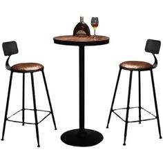 the table and two stools are next to each other with wine glasses on top