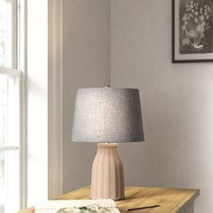 a lamp sitting on top of a wooden table