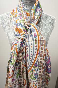 In a signature diaphanous floral print, this super soft Silk Scarf brings easy elegance to anything you wear it with. Big enough to wear as a wrap but fine enough to gather up and wear as a scarf. This tissue-weight scarf is made from a super soft silk blend in a variety of prints. One of a kind, unique individual piece. ** 72”x36” ** Hand Made ** 100% Silk ** Dry Clean only Product Type Premium Silk Scarves Overall 72"x36" Overall Product Weight 0.2 lbs Materials Silk Material Detail 100% Silk Silk Shawl Scarves For Spring, Silk Shawl Scarf For Spring, Silk Scarves With Floral Print For Spring, Bohemian Silk Shawl With Floral Print, Bohemian Silk Floral Print Shawl, Chic Silk Scarf With Floral Print For Spring, Chic Silk Scarves For Spring, Elegant Multicolor Silk Scarf For Spring, Elegant Multicolor Summer Shawl